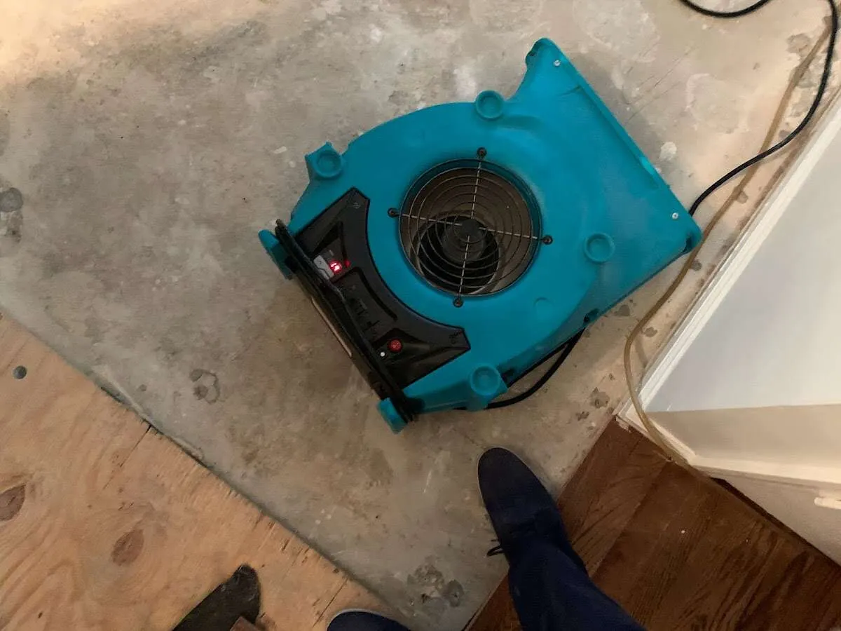 Air mover drying subfloor during Leak Detection & Repair in Riviera Beach